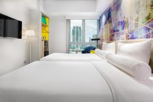 ibis Styles Manila Araneta City客房内的一张或多张床位