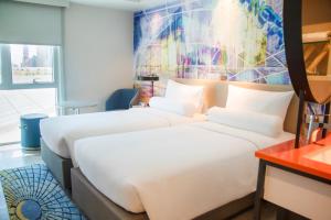 ibis Styles Manila Araneta City客房内的一张或多张床位
