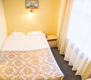Postel nebo postele na pokoji v ubytování Ankur Hotell