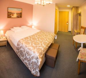 Postel nebo postele na pokoji v ubytování Ankur Hotell