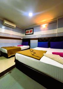 Postel nebo postele na pokoji v ubytování ARK Hotel New Wave Shah Alam
