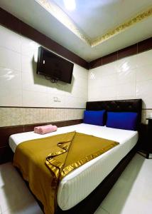 Postel nebo postele na pokoji v ubytování ARK Hotel New Wave Shah Alam