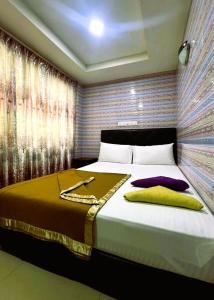 Postel nebo postele na pokoji v ubytování ARK Hotel New Wave Shah Alam