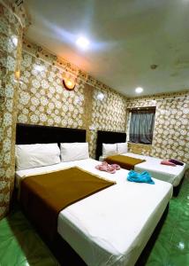 Postel nebo postele na pokoji v ubytování ARK Hotel New Wave Shah Alam