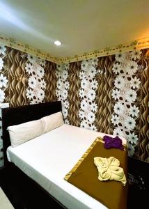 Postel nebo postele na pokoji v ubytování ARK Hotel New Wave Shah Alam