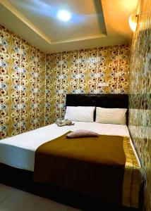 Postel nebo postele na pokoji v ubytování ARK Hotel New Wave Shah Alam
