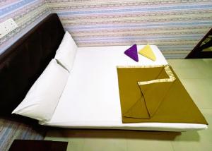 Postel nebo postele na pokoji v ubytování ARK Hotel New Wave Shah Alam