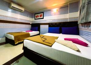 Postel nebo postele na pokoji v ubytování ARK Hotel New Wave Shah Alam