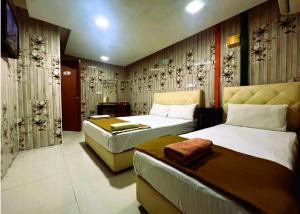 Postel nebo postele na pokoji v ubytování ARK Hotel New Wave Shah Alam