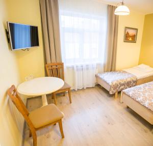 Postel nebo postele na pokoji v ubytování Ankur Hotell
