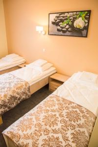 Postel nebo postele na pokoji v ubytování Ankur Hotell