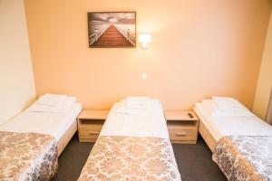 Postel nebo postele na pokoji v ubytování Ankur Hotell