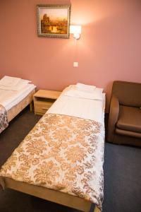 Postel nebo postele na pokoji v ubytování Ankur Hotell
