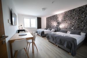 Rúm í herbergi á Garni hotel Svitavy