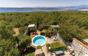 an aerial view of a villa with a swimming pool at 2 Bedroom Cozy Apartment In Jadranovo in Jadranovo