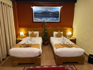 Rúm í herbergi á Annapurna Boutique Hotel