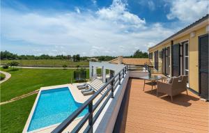 a deck with a swimming pool on top of a house at Villa Arkaim in Pula +52 photos