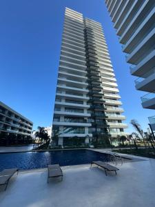 a large building with a swimming pool and two buildings at Grand Sapphire Casino studio 20 in Iskele