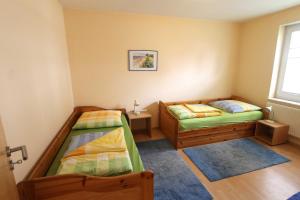 Postel nebo postele na pokoji v ubytování Villa Elsa Wohnung 9, nur 150 m vom Strand entfernt