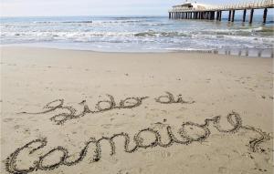 a sign written in the sand on a beach at 3 Bedroom Cozy Home In Piano Di Mommio in Piano di Mommio +20 photos