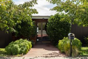 a house with a walkway leading to the front door at River Haven serene spacious with river views in Launceston