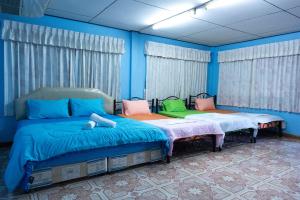 Кровать или кровати в номере Rak Ban Kerd House