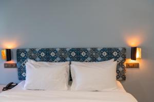 Girisadan Boutique Stay客房内的一张或多张床位