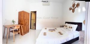 Postel nebo postele na pokoji v ubytování Nita Guest House Bali