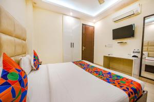 Postel nebo postele na pokoji v ubytování FabHotel AK Villa