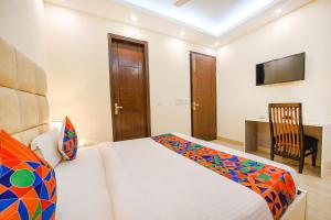 Postel nebo postele na pokoji v ubytování FabHotel AK Villa