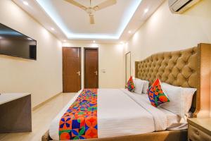 Postel nebo postele na pokoji v ubytování FabHotel AK Villa