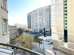a view of a city from a balcony of a building at Nizami Luxury Apart in Baku +26 photos
