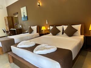 Postelja oz. postelje v sobi nastanitve Hotel Heladiv