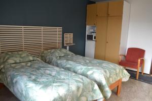 Postel nebo postele na pokoji v ubytování Hotel Takka-Valkea