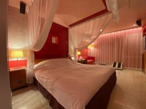 Ένα ή περισσότερα κρεβάτια σε δωμάτιο στο Hotel LIBERTY一宮店