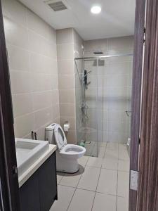 a bathroom with a toilet and a sink and a shower at Green Haven Unique Relaxing Home & Netflix in Masai