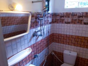 Koupelna v ubytování Grand Holidays Kandy + 9 fotografií