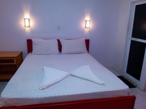 Postel nebo postele na pokoji v ubytování Grand Holidays Kandy