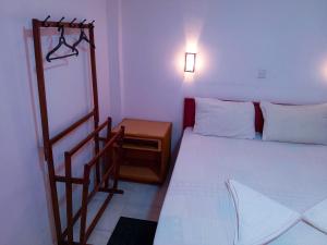 Postel nebo postele na pokoji v ubytování Grand Holidays Kandy