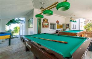 a billiard room with two pool tables in it at La Dolce Vita in San Costanzo