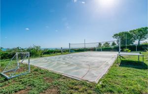 a basketball court in a park with a basketball hoop at La Dolce Vita in San Costanzo