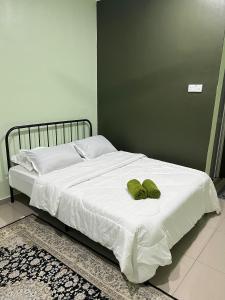 Voodi või voodid majutusasutuse Sialang Damai Inn toas