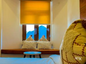 Rúm í herbergi á Hotel Wraveler Inn Mussoorie