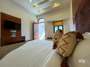 Rúm í herbergi á Hotel Wraveler Inn Mussoorie