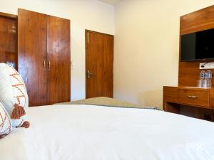 Rúm í herbergi á Hotel Wraveler Inn Mussoorie