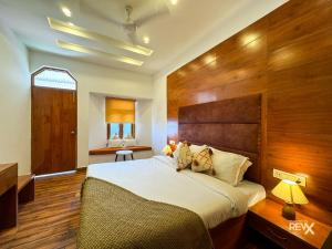Rúm í herbergi á Hotel Wraveler Inn Mussoorie
