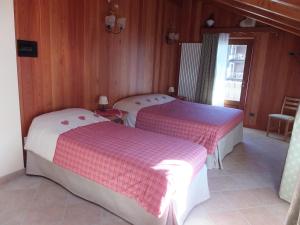 Postel nebo postele na pokoji v ubytování Maison Gaudenzio