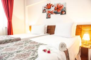 Postel nebo postele na pokoji v ubytování Hotel Parc Sibiu