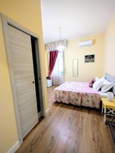 Postel nebo postele na pokoji v ubytování Al Quadrato D'Oro rooms