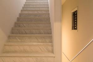a staircase in a home with wooden floors at Barberini Retreat in Rome